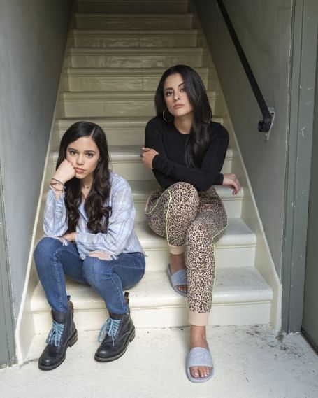 ellie and delilah sitting on the stairs 